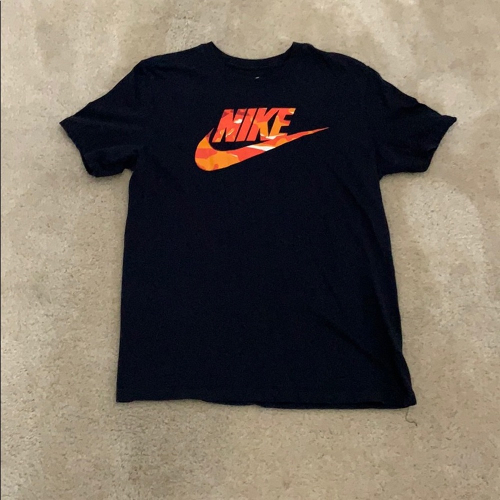 Black Nike t-shirt with orange Nike sign.